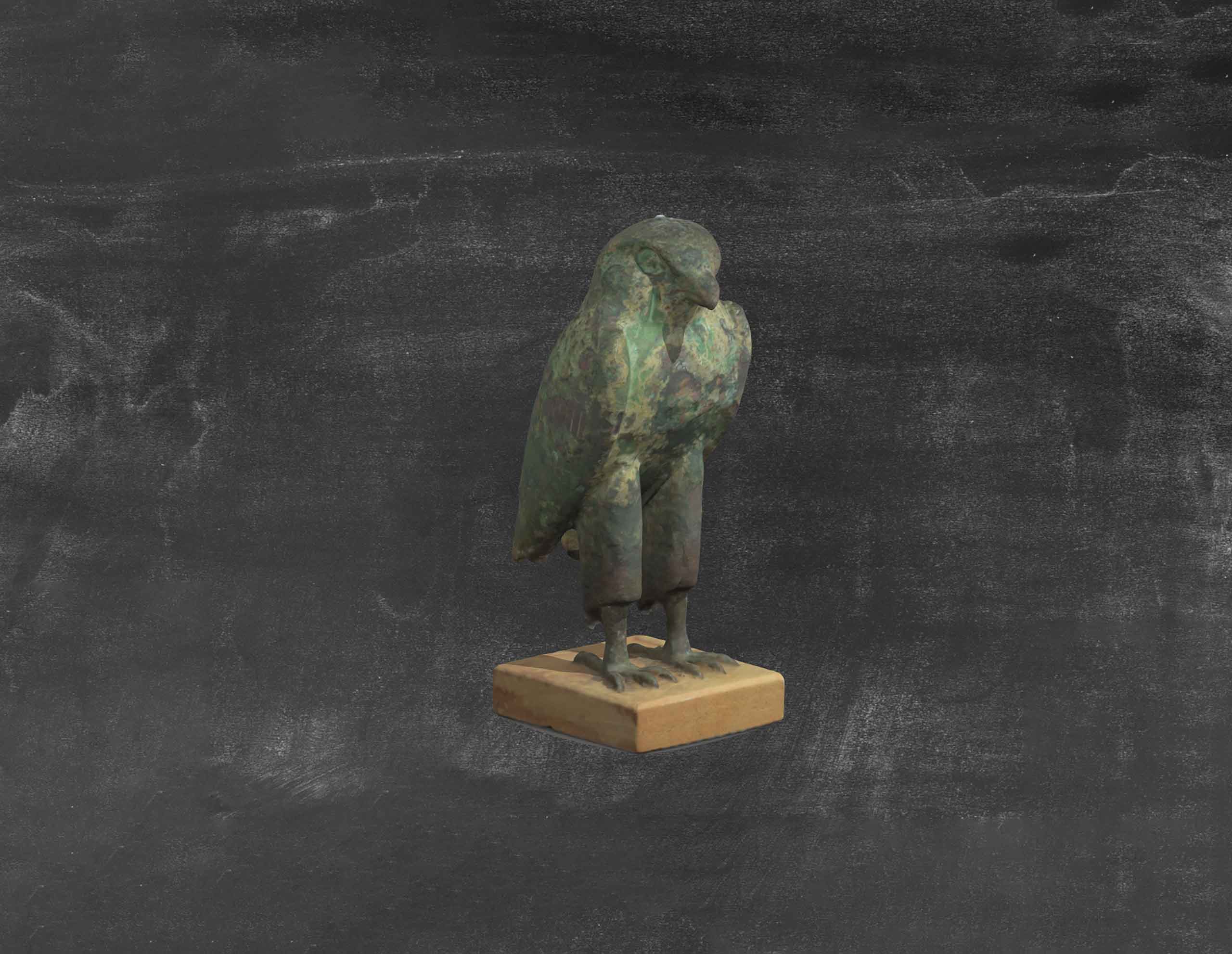 3D Library. Statuette of a bird on a grey background